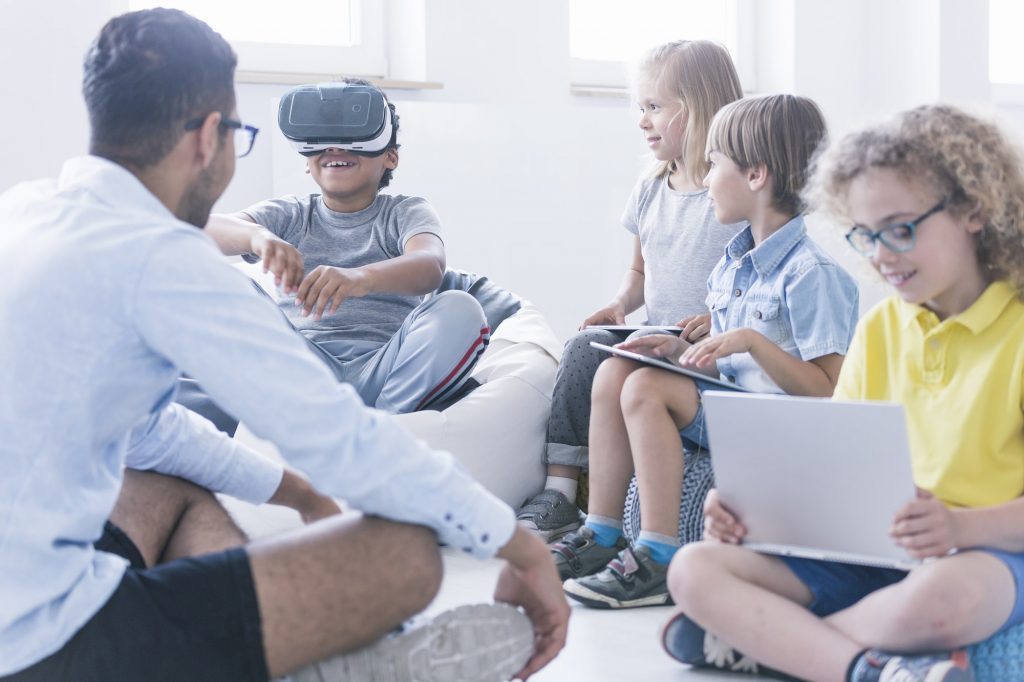 Boy uses VR glasses